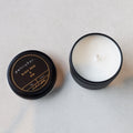 Petrichor candle with lid on a light gray background
