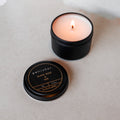 Petrichor candle with lid on a light gray background