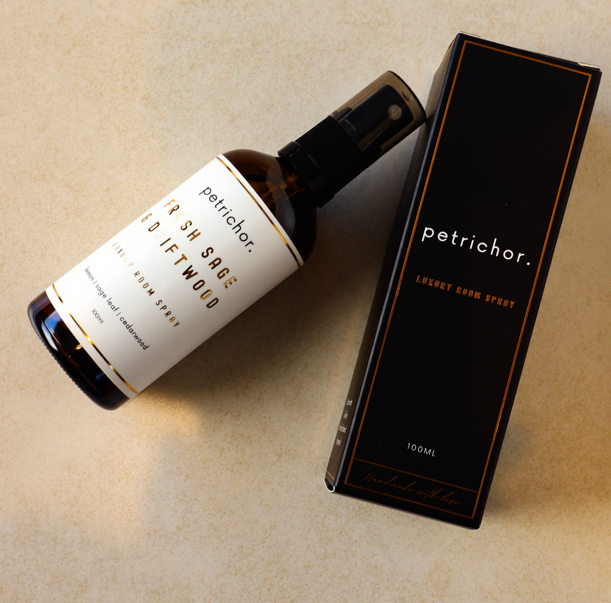 Petrichor bottle and packaging on a beige surface