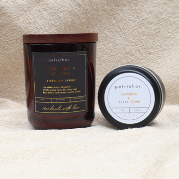 Petrichor candles with labels on a textured surface