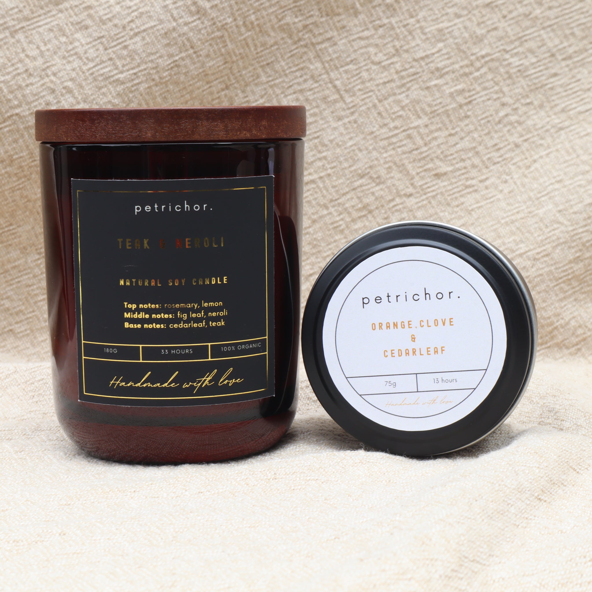 Petrichor candle with label on a textured beige background