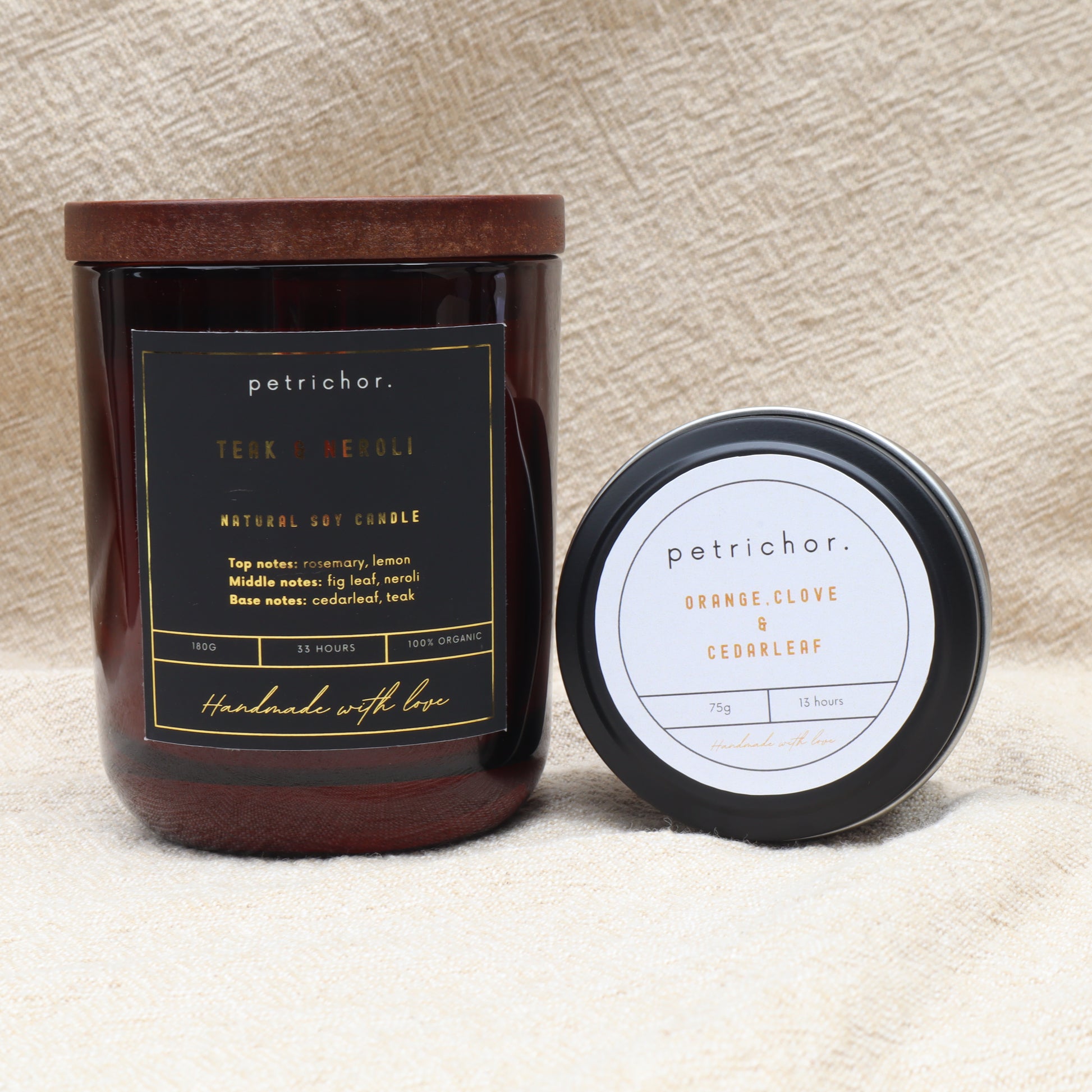 Petrichor candle with label on a textured beige background