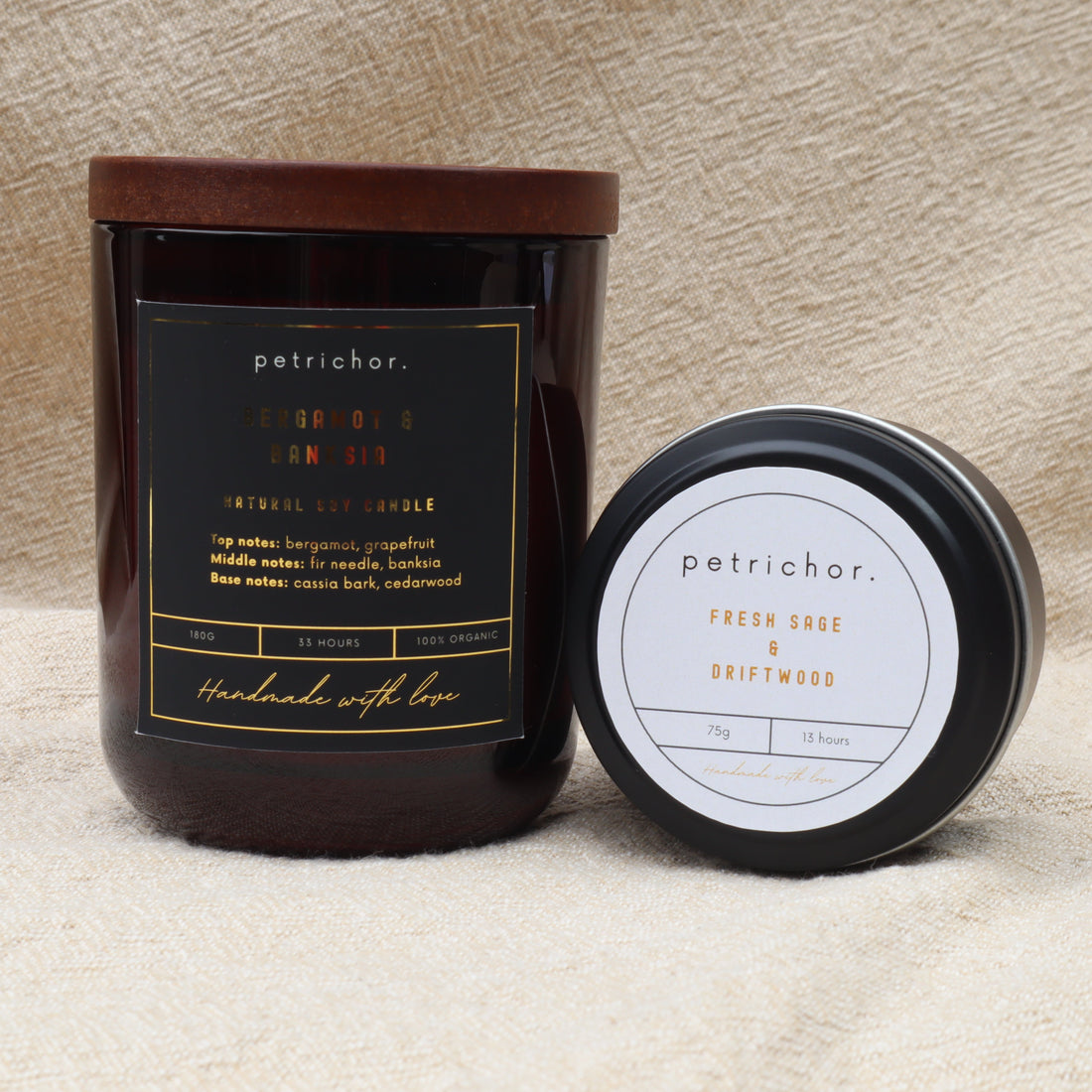 Petrichor candle with label and lid on a textured surface