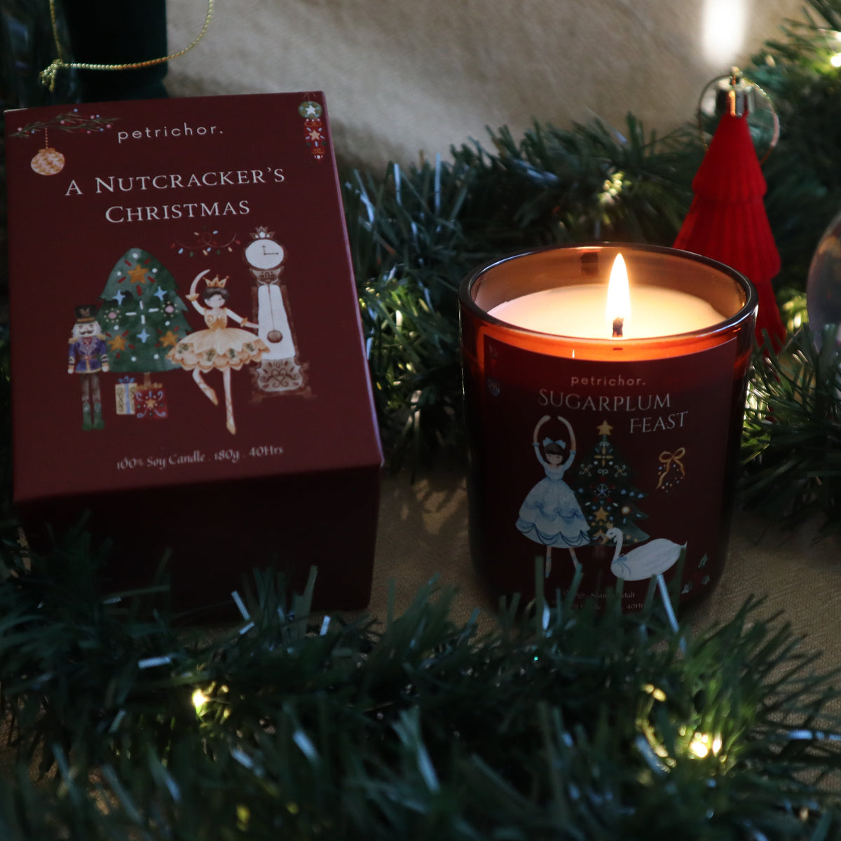 Lit Sugarplum Feast Christmas candle with fairy lights and its gift box