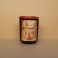 Candle with 'Seville Sunset' label on a beige background