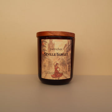 Candle with 'Seville Sunset' label on a beige background