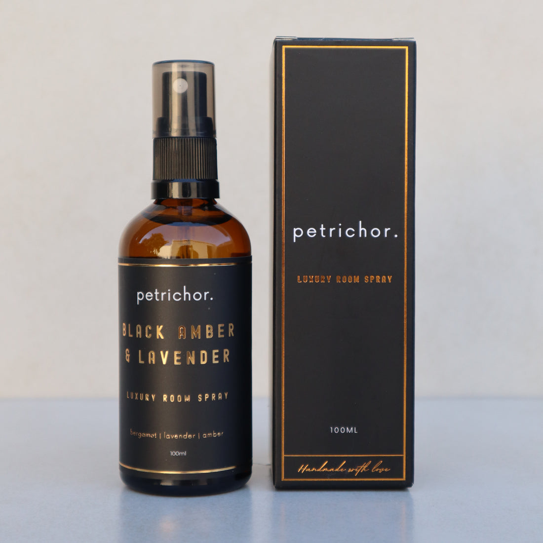 Bottle of petrichor Black Amber & Lavender on a light gray background