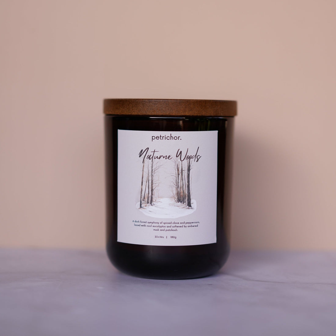 Candle with a label on a beige background