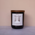 Candle with a label on a beige background